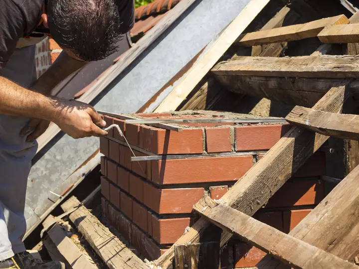 Chimney stack being rebuilt in brick