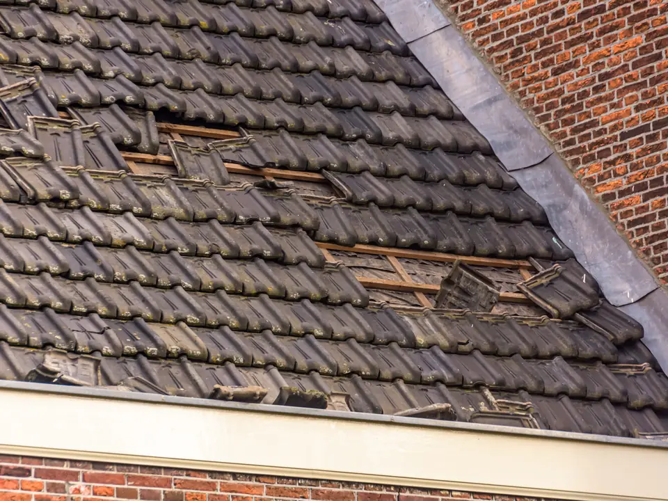 Tiled roof with slipped and missing tiles
