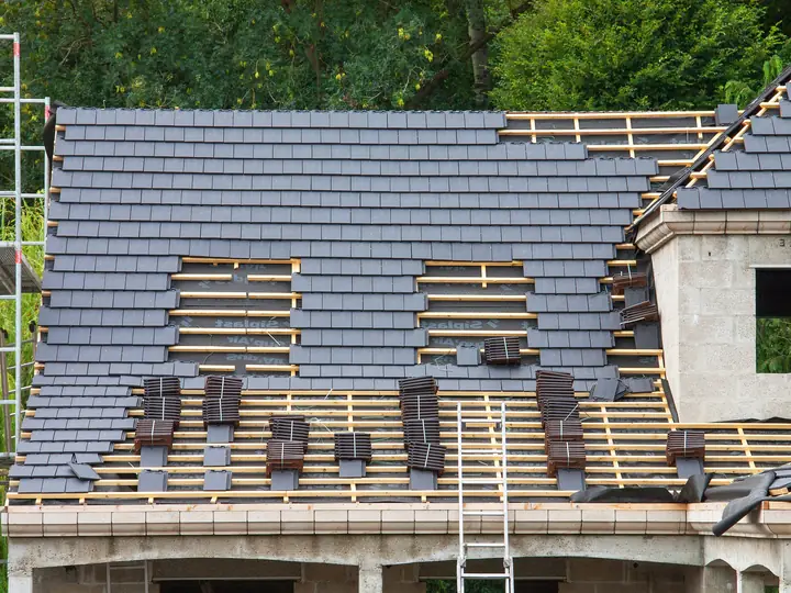 New roof part tiled over fresh battens