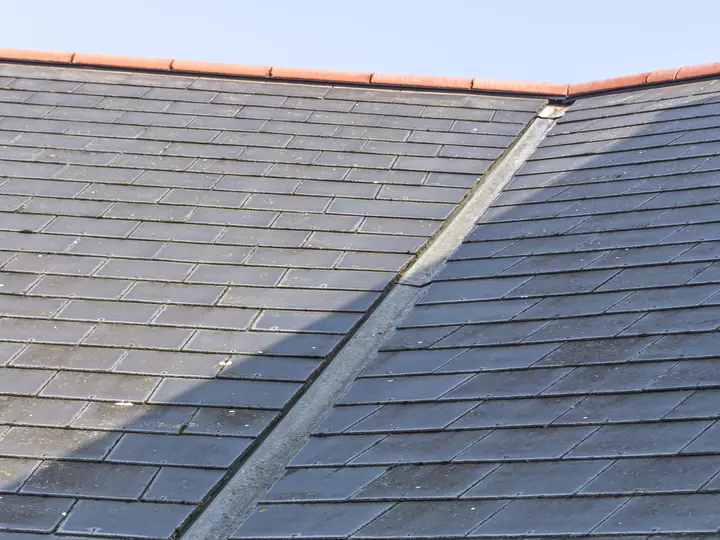 Slate roof slopes meeting at a valley